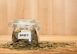 The Truth about Enhanced Maternity Pay 1 Moneybox with baby written on the outside